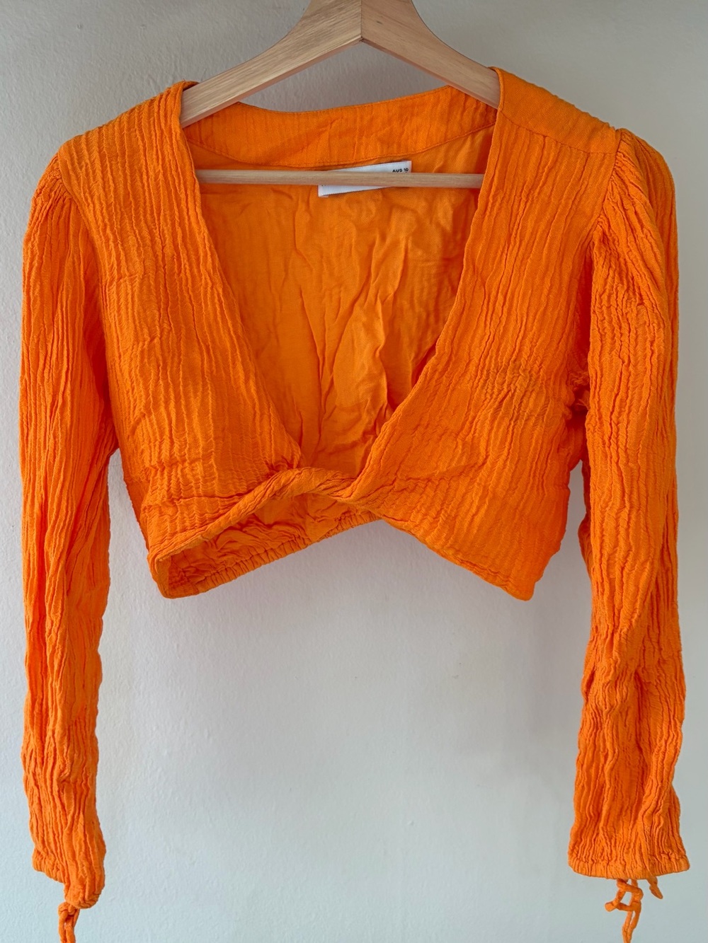 Cropped Twist-Front Long Sleeve Top in Bright Orange